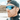 A man in a black backwards cap and Julbo-usa Ultimate Cover reflective mountain eyewear with a panoramic lens stands outdoors in a snowy, mountainous landscape.