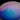 A close-up of a circular surface with a gradient of blue, purple, and pink colors blending softly, resembling a cloudy sky or liquid in a dish.