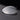 A single clear convex lens is shown resting on a reflective black surface, displaying its curved shape and transparency.