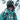 A person wearing a helmet, goggles, and a teal jacket stands in a snowy outdoor setting with ski equipment in the background.