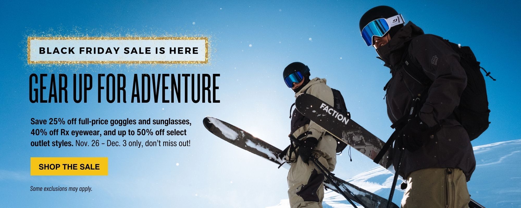 Image of two skiers standing on a hillside looking down the hill in Julbo goggles. There is a header that reads