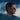 Man wearing colorful sunglasses with a blurred background