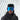 A person wearing a black jacket, black knit hat, and large reflective blue ski goggles stands in front of a curved, light-colored background.