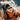 A hiker, geared up with Julbo Eyewear Monterosa 2.0 RX sunglasses with Spectron Rx polycarbonate lenses, a headband, orange jacket, and backpack, is ready for mountain performance outdoors.