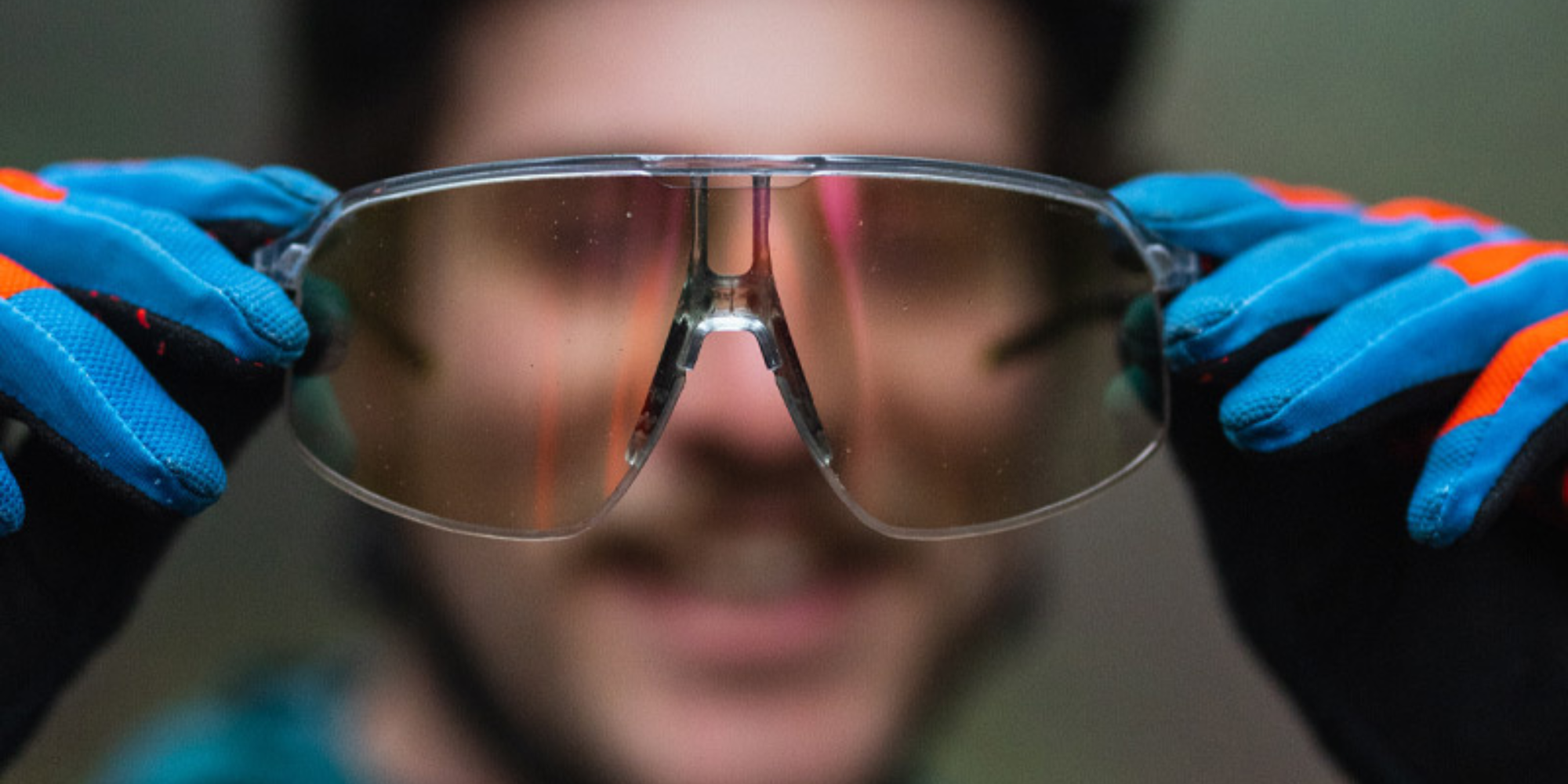 Man holding up density sunglasses