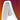 Close-up of temple arms inspired by Julbo USA Rush Lenses & Parts, showcasing a modern angular white chair against a blurred red, orange, and pink background. #color_rush-nose-pads-pair-white