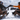 Two skiers cheersing their drinks while wearing the Shield M sunglasses
