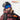 A person in a helmet and ski goggles smiles on a snowy slope; the REACTIV PHOTOCHROMIC logo appears in the top right corner.