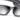 Close-up of a pair of black wraparound sunglasses with dark gradient lenses, set against a white background.