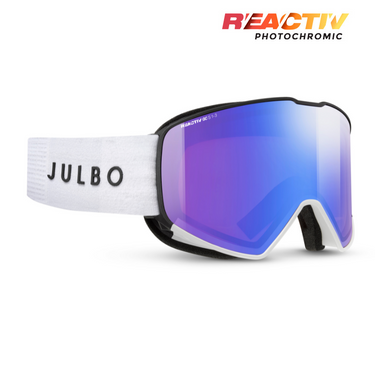 Julbo snow goggles with a white textured strap, black frame, and a blue-to-purple mirrored lens. The JULBO brand name is printed on the strap, and the REACTIV PHOTOCHROMIC logo is visible in the top right corner. #color_white-black-with-reactiv-1-3-glare-control-lens