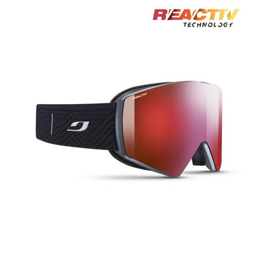 The Julbo USA Razor Edge is a black frameless ski goggle with a red REACTIV photochromic lens, REACTIV Technology branding, and a patterned strap featuring a white logo.