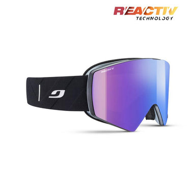 The Julbo USA Razor Edge is a black frameless ski goggle with a wide, mirrored purple REACTIV lens and a black strap featuring a white logo, shown on a white background with "REACTIV TECHNOLOGY" in the top right corner.