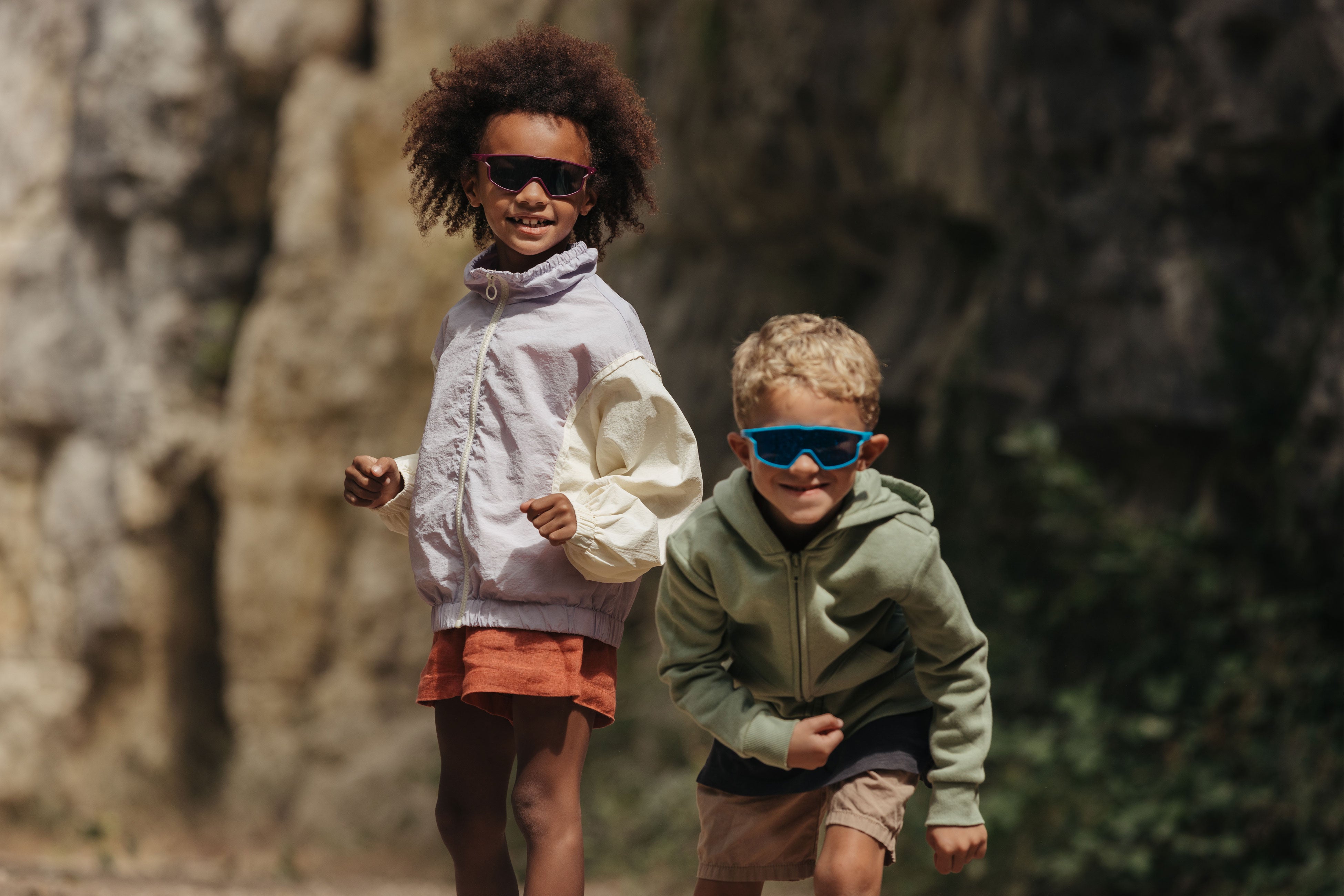 Two children having fun in their Julbo sunglasses