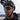 Person wearing a helmet and sunglasses with a blurred natural background. #color_white-with-spectron-3-lens