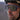 Close-up of a person wearing sunglasses and a helmet with 'Julbo' branding. #color_matte-violet-with-spectron-3-lens