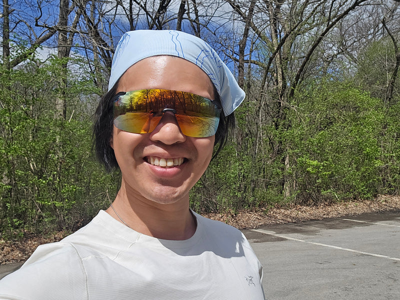 man smiling while wearing Julbo Faster sunglasses