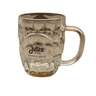 The Julbo Né dans les Alpes Beer Stein (16oz) by Julbo Eyewear is a clear glass stein with a thick handle, embossed pattern, and black Julbo 1888 logo plus geographic coordinates on the front—celebrating its Alpine origins.