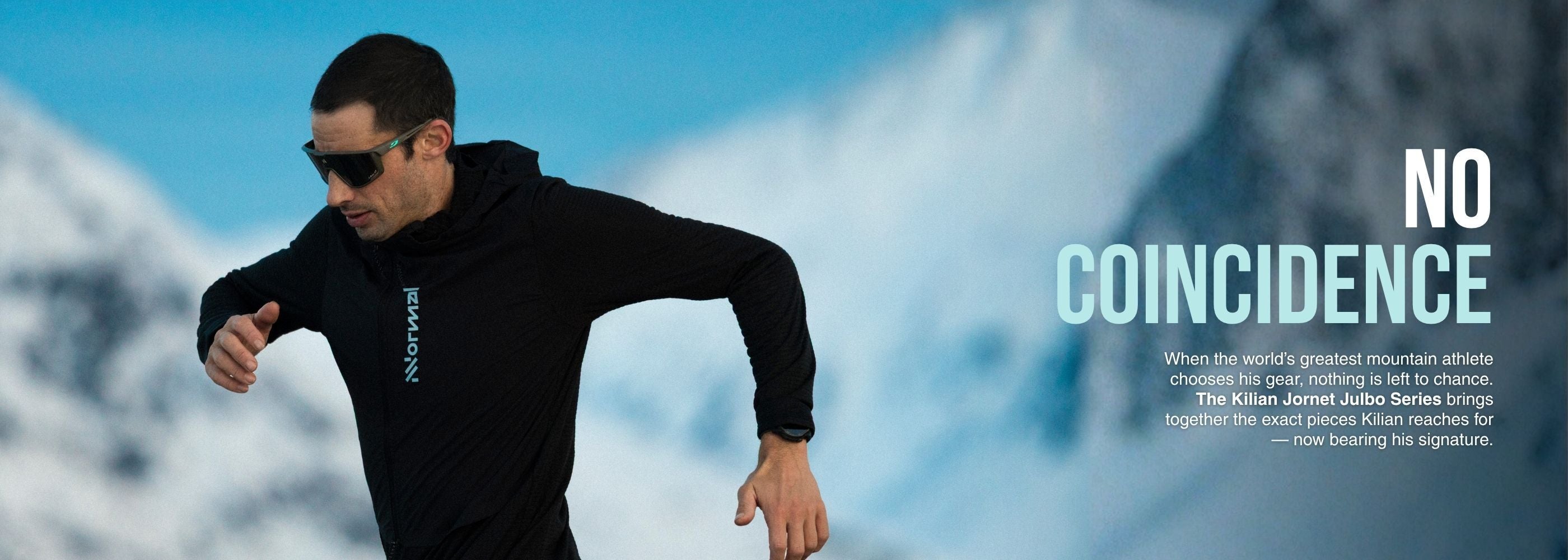 A man in black athletic clothing and sunglasses runs outdoors in a snowy mountain landscape with text that reads No Coincidence.