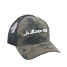 A camouflage trucker hat with black mesh back panels and a white 'Julbo' logo printed on the front, shown against a plain white background. #color_basecamp-trucker-hat-camo