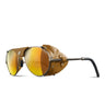 The Julbo-usa Cham is a pair of brown alpine classic mountaineering sunglasses featuring mirrored orange lenses, leather side shields, and black temple tips. #color_copper-tobacco-with-spectron-3-lens