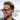 Man wearing Julbo creek sunglasses while riding on a boat