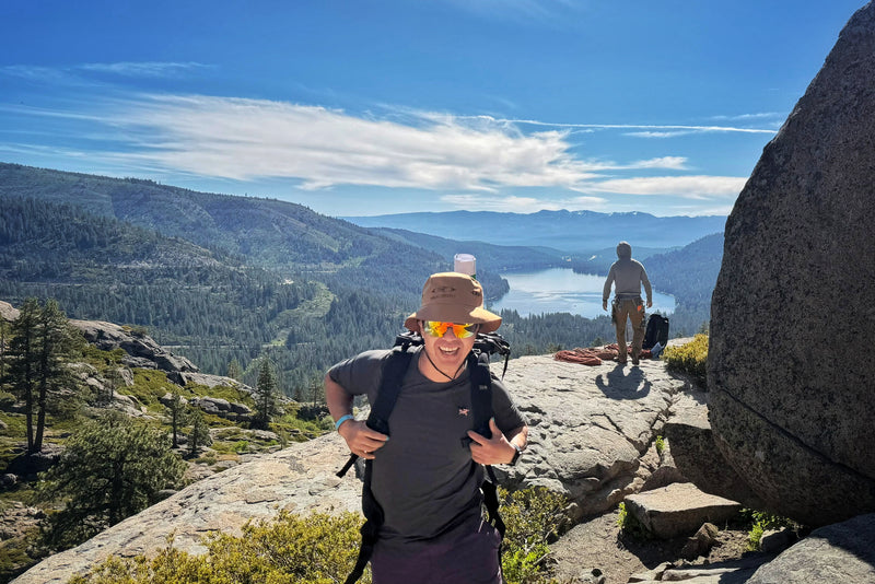 man hiking while wearing Julbo Faster sunglasses