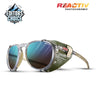 Sunglasses with green frame and blue-tinted lenses on a white background, featuring 'REACTIV' branding. #color_translucent-beige-with-reactiv-2-4-lens