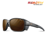The Julbo-usa Montebianco 2 mountain sunglasses come in matte black with brown lenses, removable side shields, and Reactiv technology branding on the frame and top right corner. #color_black-with-reactiv-2-4-polarized-lens
