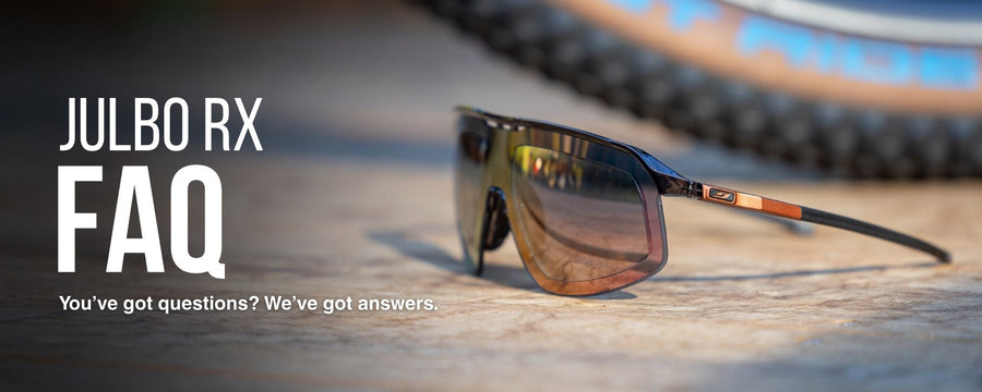 Sunglasses with brown-tinted lenses rest on a wooden surface next to a blurred bicycle tire. Text reads: Julbo RX FAQ. Youve got questions? Weve got answers.