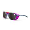 The Julbo Eyewear Slack Cover sunglasses feature a sporty design with a polarized lens, translucent blue frame, pink and yellow accents, and removable side shields. #color_blue-pink-with-spectron-4-lens