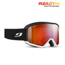 Reactiv ski goggles with a black frame, white trim, a black strap with a white logo, and a red-to-orange reflective photochromic lens. The REACTIV PHOTOCHROMIC logo is displayed in the top right corner. #color_black-white-with-reactiv-0-4-high-contrast-lens