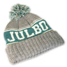 The Julbo Eyewear Classic Pom Beanie is a gray winter hat with green and white stripes, a pom-pom, and "JULBO" knitted on the front—perfect for staying warm in Alpine style. #color_julbo-classic-pom-beanie-grey-green-and-lime