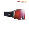 The Julbo USA Razor Edge is a black frameless ski goggle with a red REACTIV photochromic lens, REACTIV Technology branding, and a patterned strap featuring a white logo.