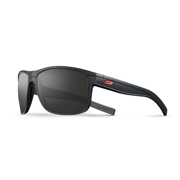The Julbo Eyewear Renegade RX is a black wraparound prescription sunglass with rectangular polarized Spectron Rx polycarbonate lenses, thick temples, and a small red logo on the arm. Shown on a white background. #color_black-/-red