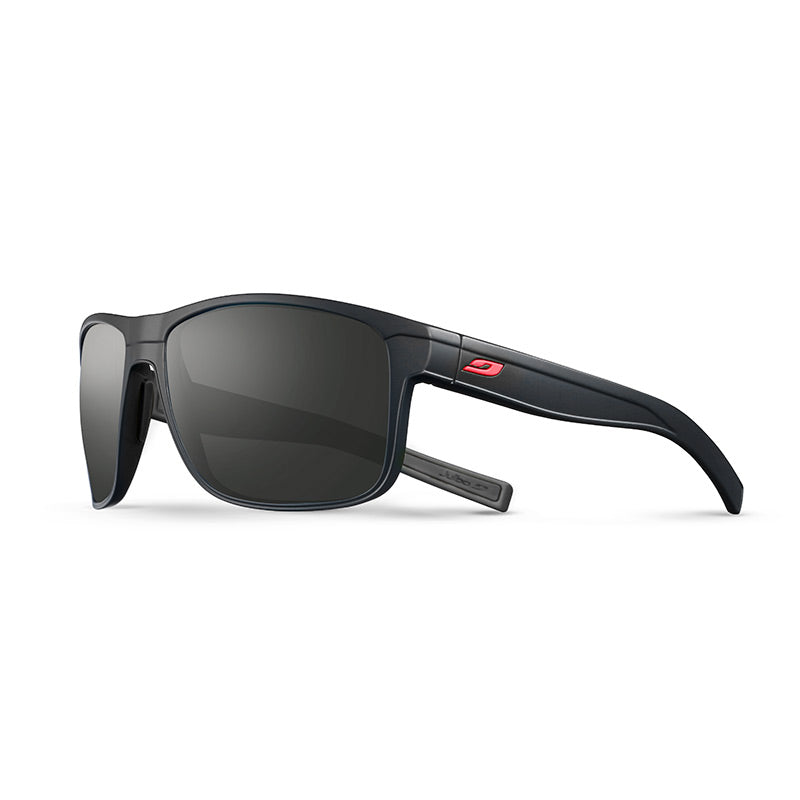 The Julbo Eyewear Renegade RX is a black wraparound prescription sunglass with rectangular polarized Spectron Rx polycarbonate lenses, thick temples, and a small red logo on the arm. Shown on a white background. #color_black-/-red