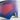 Close-up of a pair of ski goggles with a large, curved blue and pink reflective lens and black foam padding.