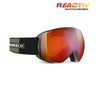 Julbo snow goggles with a red-to-orange reflective photochromic lens and a black and olive green strap, shown on a white background with a 'REACTIV PHOTOCHROMIC' badge in the top right. #color_green-black-with-reactiv-0-4-high-contrast-lens