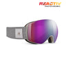 A pair of JBLX snow goggles with a gray strap and a purple-to-blue mirrored lens, shown on a white background with a 'REACTIV PHOTOCHROMIC' logo in the top right corner. #color_gray-with-reactiv-0-4-high-contrast-lens