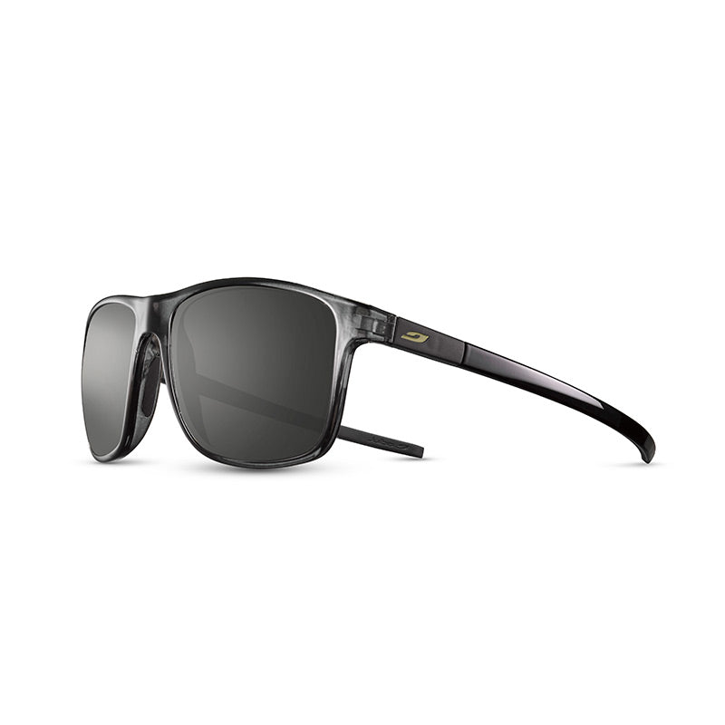 The Streets RX by Julbo Eyewear are black, rectangular wraparound sunglasses featuring dark tinted Spectron Rx polycarbonate lenses and a subtle gold logo on the side. #color_translucent-black-/-black