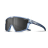 The Julbo-usa Fury Mini Kids sunglasses feature a translucent blue frame, large dark wraparound lenses with SPECTRON printed on them, and a logo on the temple—perfect for kids on the pump track. #color_translucent-blue-matte-blue-with-spectron-3-lens